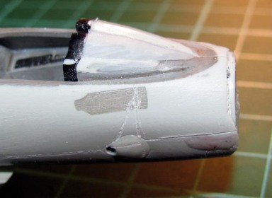 Here's the FR bulge totally filled, sanded and with the panel lines re-etched. Apoxie Sculp Rules!