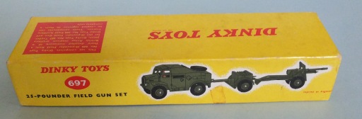 This is the other side of the box, which is in a bit better shape. The art is very eye-catching, and the white outline, typical of Dinky Toys, really makes the military drabness of the vehicles stand out on the bright background!