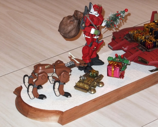 This view from the left end shows how the Reindeer B'Cue, the Type 74 and the Elf fit into the picture, with the Santa Gundam in the background.